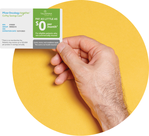 Hand holding a copay assistance card